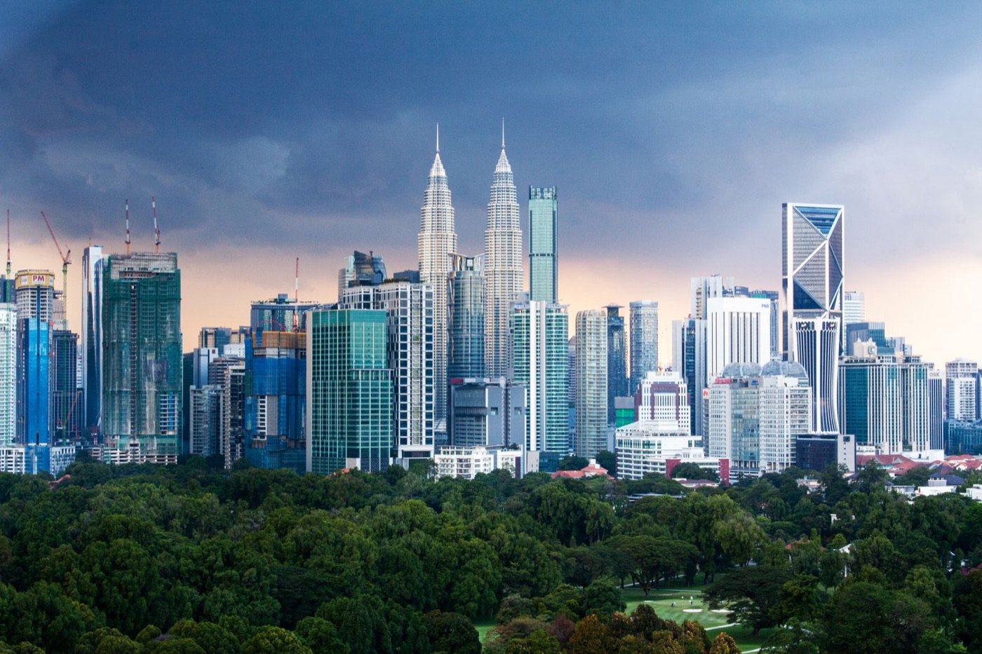 Kuala Lumpur skyscrapers rising above the city’s green parkland